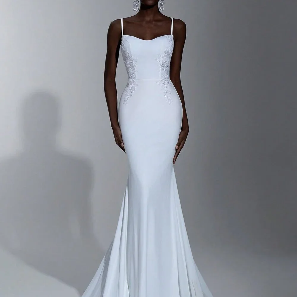 fishtail backless wedding dress Custom-made Lace Applique Backless mermaid wedding dress with Backless Design, Spaghetti Straps, Ruffles, and Satin Fabric